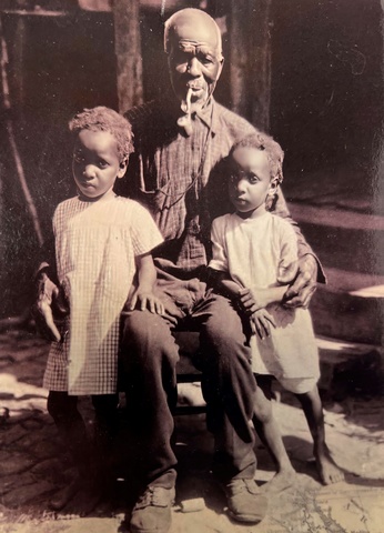 Last survivor of the Clotilda. Photo of a man and two children